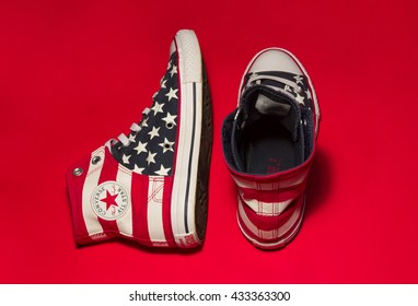 Kiev, Ukraine - May, 29 2016: All Star Converse Sneakers On Red Background