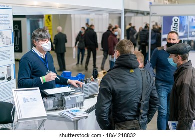 Kiev, Ukraine November 25 2020. Industrial Exhibition during a pandemic. People at the exhibition wearing medical masks. Exhibition and social distance.