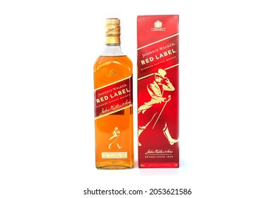 Kiev, Ukraine - October 06, 2021: Johnnie Walker - in a bottle and box on a white background, the most widespread brand of blended Scotch whiskey in the world.