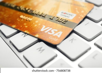 KIEV, UKRAINE - OCTOBER 2, 2017: Golden Visa Credit Card On Keyboard