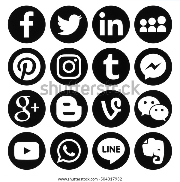 Kiev, Ukraine - October 25, 2016: Collection of\
popular black round social media icons printed on paper: Facebook,\
Twitter, Google Plus, Instagram, Pinterest, LinkedIn, Blogger,\
Tumblr and others