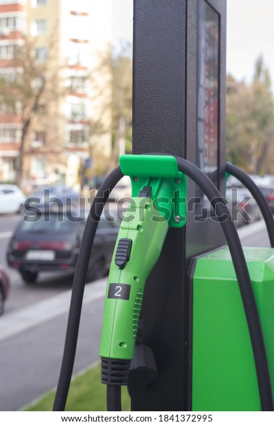 
KIEV, UKRAINE - OCTOBER 26, 2020: Charging station
for the engine of electric vehicles. The sustainable energy
solution for the transport of the future. Power supply unit for
recharging the car.