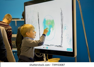 Kiev, Ukraine October 7, 2017: Draws Finger Large Touch Screen