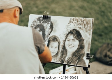 Kiev / Ukraine - September 1 2018: Caricature Artist Drawing On Street