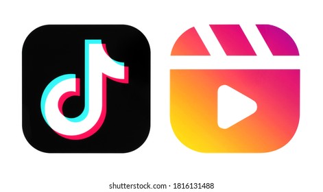 Kiev, Ukraine - September 14, 2020: TikTok and Instagram Reels icons, printed on paper. Instagram launches Reels for making and sharing short videos, it is a clone of TikTok.