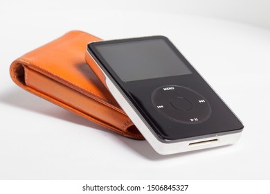 KIEV, UKRAINE - September 17, 2019: Close Up On A Classic 80 GB IPod, Drawing On A White Background.
Original Orange Case