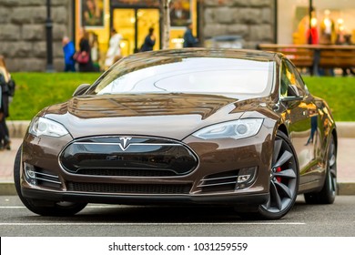 Kiev, Ukraine - September 20, 2017: Close-up of modern electric Tesla car on the city street. Future of urban transportation concept. Tesla Type S is one of the most expensive electric cars in world