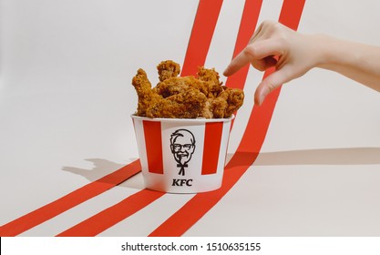 Kiev, Ukraine - September 21, 2019: hands hold KFC fried chicken 