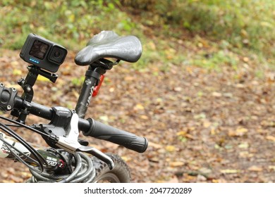 Kiev, Ukraine, September 24, 2021. Action Camera Gopro 10 Fixed To The Bike. Filming Of Cycling In The Forest On Gopro 10. 