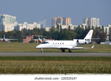 KIEV, UKRAINE - September 27, 2014: Small Jet Taking Off In Kiev International Airport