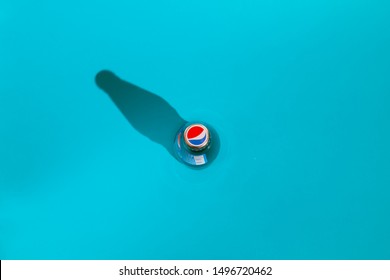 Kiev, Ukraine - September 5, 2019: a bottle of Pepsi, top view, in focus cap on a blue background