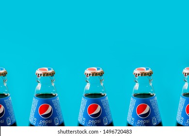 Kiev, Ukraine - September 5, 2019: glass Pepsi bottles on a blue background