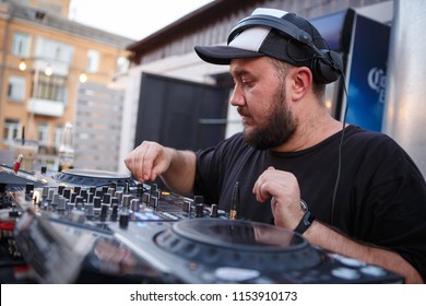 KIEV-10 JULY,2018: DJ Panchez Plays Musical Set In Party Bar.Hip Hop Disc Jockey Mix Music Tracks With Pioneer CDJ Turntables And DJM Sound Mixer In Summer Bar Outdoor.Disco Club Entertainment Event