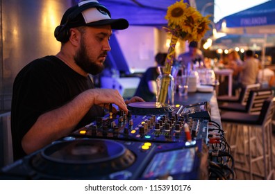 KIEV-10 JULY,2018: DJ Panchez Plays Musical Set In Party Bar.Hip Hop Disc Jockey Mix Music Tracks With Pioneer CDJ Turntables And DJM Sound Mixer In Summer Bar Outdoor.Disco Club Entertainment Event