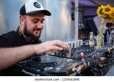 KIEV-10 JULY,2018: DJ Panchez Plays Musical Set In Party Bar.Hip Hop Disc Jockey Mix Music Tracks With Pioneer CDJ Turntables And DJM Sound Mixer In Summer Bar Outdoor.Disco Club Entertainment Event