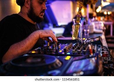 KIEV-10 JULY,2018: DJ Panchez Plays Musical Set In Party Bar.Hip Hop Disc Jockey Mix Music Tracks With Pioneer CDJ Turntables And DJM Sound Mixer In Summer Bar Outdoor.Disco Club Entertainment Event