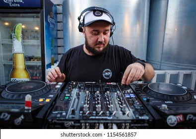 KIEV-10 JULY,2018: DJ Panchez Plays Musical Set In Party Bar.Hip Hop Disc Jockey Mix Music Tracks With Pioneer CDJ Turntables And DJM Sound Mixer In Nightclub Outdoor.Disco Club Entertainment Event