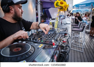 KIEV-10 JULY,2018: DJ Panchez Plays Musical Set In Party Bar.Hip Hop Disc Jockey Mix Music Tracks With Pioneer CDJ Turntables And DJM Sound Mixer In Summer Bar Outdoor.Disco Club Entertainment Event