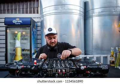 KIEV-10 JULY,2018: DJ Panchez Plays Musical Set In Party Bar.Hip Hop Disc Jockey Mix Music Tracks With Pioneer CDJ Turntables And DJM Sound Mixer In Summer Bar Outdoor.Disco Club Entertainment Event