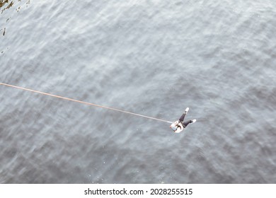 Kiev,Ukraine,02 August 2021: Woman Doing A Bungee Jump From The Bridge Under River Dnepr In Summer Time.
