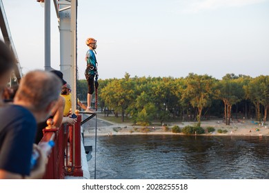 Kiev,Ukraine,02 August 2021: Woman Doing A Bungee Jump From The Bridge Under River Dnepr In Summer Time.
