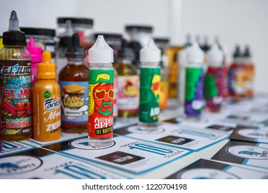 KIEV,UKRAINE-27 OCTOBER,2018: Plastic Bottles With E-liquids For Smoking Tobacco With Tasty Fresh Flavor.Buy New Bottle With Vape Juice,quit Smoking Nicotine.Plastic Containers With Flavored Glycerin