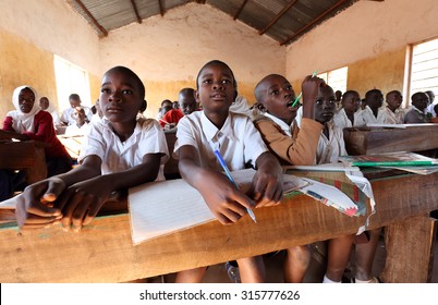 KIGOMA - TANZANIA - JULY 9, 2015: Unidentified students in primary school on July 9, 2015 in Kigoma, Tanzania. Tanzania has still an alarming drop-out rate of students in primary school