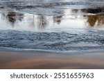 Kiiminkijoki river freezing over in Haukipudas, Oulu Finland