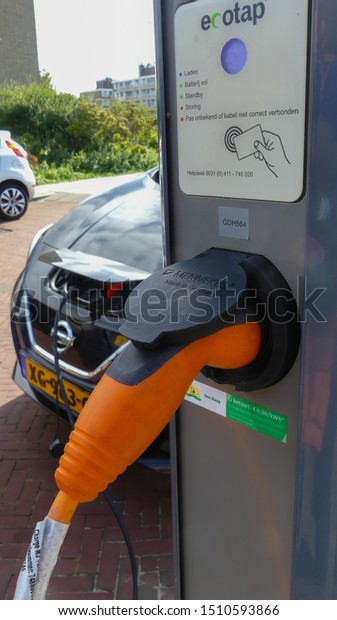 Kijkduin, the Netherlands - September 15
2019: Tesla electric car charging batteries at plug in charge
station in the
Netherlands