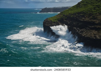 Kilauea Cliffs: Dramatic coastal cliffs on Kauai, Hawaii's north shore. Towering heights offer stunning views of the Pacific. diverse birdlife, including albatross and frigatebirds. A natural wonder  - Powered by Shutterstock