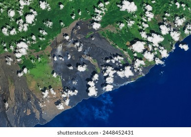 Kilauea Lava Enters the Ocean. Lava from Kilauea Volcano flows into the ocean near Kalapana, Hawaii. Elements of this image furnished by NASA. - Powered by Shutterstock