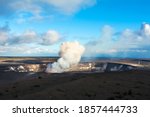 Kilauea volcano exploding after an earthquake spills rocks into the molten lava of the active vent within the caldera.