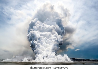 Kilauea Volcano Fissure 8 Lava Explosion. Exploding and steaming lave pours into the ocean at fissure 8 from the Kilauea Volcano. This close up perspective was captured from a See Lava Tours boat.   - Powered by Shutterstock