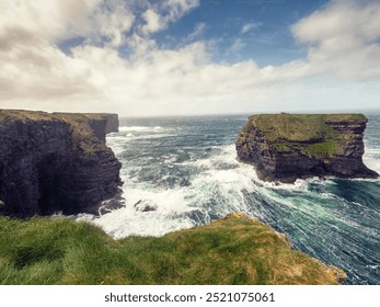 Kilkee cliff in county Clare, Ireland. Popular travel area with stunning nature scenery with green fields, ocean and dramatic sky. Irish landscape. Rough coast line. Warm sunny day. - Powered by Shutterstock