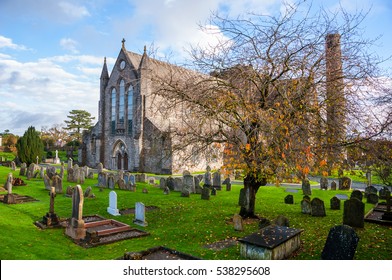 Kilkenny, Ireland. Cemetery In Front Of Cathedral Church Of St Canices In Kilkenny, Ireland During The Cloudy Day