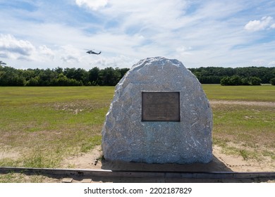 Kill Devil Hills, North Carolina -2022: Wright Brothers National Memorial. First Flight Boulder Commemorates Spot Where Wright Brothers Achieved Lift Off. U.S. Air Force HH-60 Pave Hawk Helicopter. 