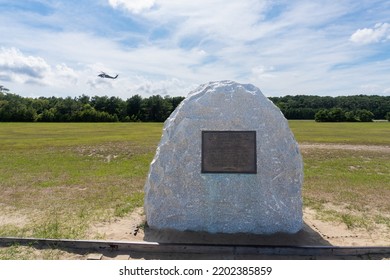 Kill Devil Hills, North Carolina -2022: Wright Brothers National Memorial. First Flight Boulder Commemorates Spot Where Wright Brothers Achieved Lift Off. U.S. Air Force HH-60 Pave Hawk Helicopter. 