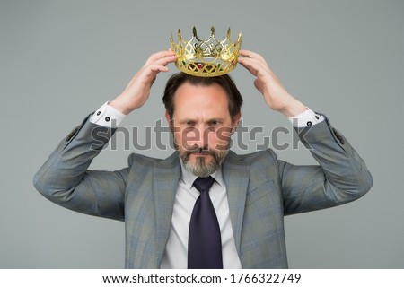 Kill your pride before you lose your head. Big boss wear crown with pride. Proud businessman grey background. Bearded man in formalwear. Pride and egoism. Pride and ambitions. Toxic ego.