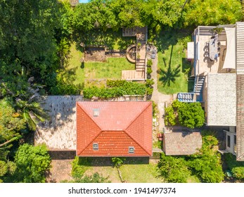 Killara, Sydney, Australia - Nov 26 2020: Aerial Day Time Top Down View Of A Suburban Home House With Stairs, Deck, Garden And Garage