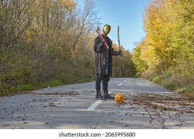 Killer with wooden ax in the forest