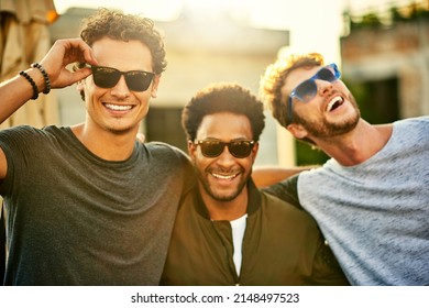Killing it in the shades game. Shot of a group of young men hanging out together outdoors. - Shutterstock ID 2148497523