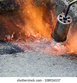 Killing Weeds With Gas Powered Flame Of Weed Burner