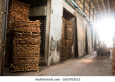 Kiln Drying Wood Warehouse With Forklift In A Flare Light