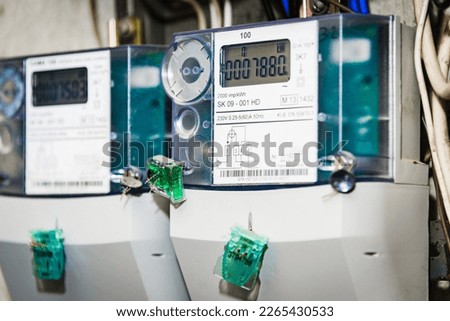Kilowatt hour electric meters, power supply meters.Close-up of modern smart grid residential digital power supply meter.Indoors shot.Selective focus.