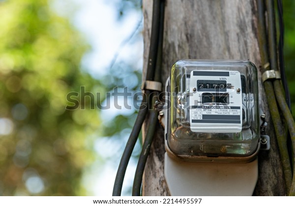 Kilowatt hour meter on blur sky background.\
Electric power meter measuring power usage. Electricity Monitoring\
Equipment. measument energy\
consumption.