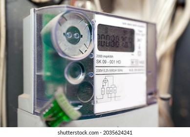 Kilowatt hour single stator power company meter.Watthour meter of electricity for use in home.This is a modern technology that can monitor the home's electrical energy consumption.Indoors shot.