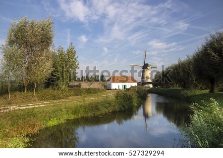 The Kilsdonkse windmillThe Kilsdonkse mill on the river Brabantse Aa near the Dutch village Dinther is a unique combination of windmill and watermill Stock photo © 