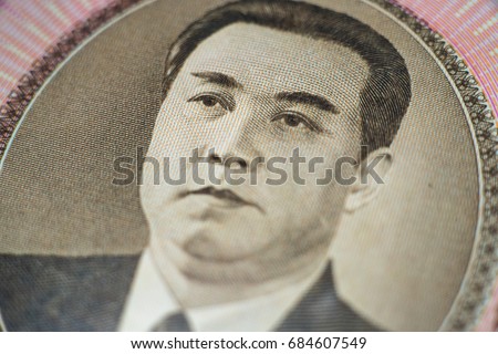 Kim Il-sung's head portrait in North Korea 100 Won banknote from macro shot