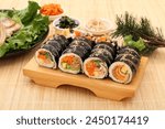 Kimbap is a Korean-style nori roll, which is rolled with rice mixed with sesame oil, salt, and other ingredients on top of nori.