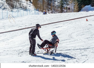 KIMBERLEY, CANADA - MARCH 19, 2019: Handicapped Person Riding A Mono Ski Vancouver Adaptive Snow Sports.